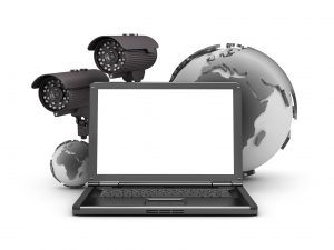 Security cameras, laptop and earth globe on white background