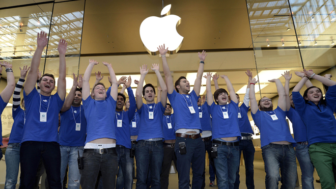 March 16, 2012: Apple employees welcomes hundreds of customers in front of the Apple store at a shopping mall in Oberhausen, western Germany, as the new iPad goes on sale.