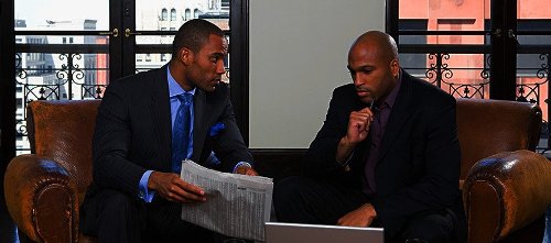 two_men_discussing_business_header