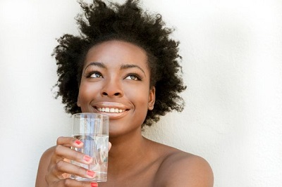 African-American-woman-holding-a-glass-of-water