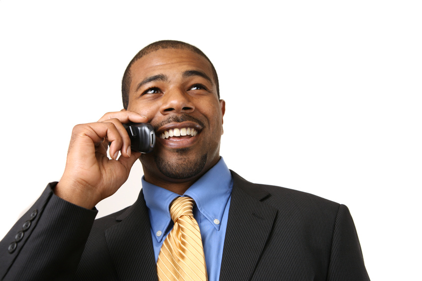 African American businessman talking on mobile phone, smiling