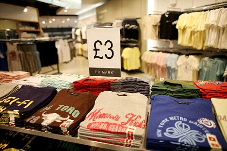4th APRIL- LONDON ; Piles of cheap T shirts in the new Primark flagship store opening tomorrow in Oxford Street, London. menswear clothes clothing fashion © Graeme Robertson / Guardian / eyevine For more information contact eyevine: T: 020 8709 8709 E: GNMrights@eyevine.com www.eyevine.com
