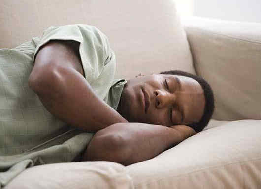 african_american_man_sleeping_on_sofa_bld041174